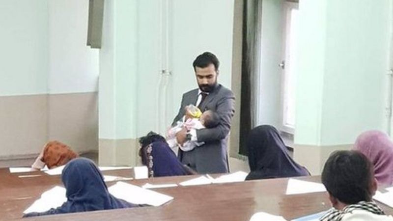 Kabul University teacher feeding student’s child during an exam wins hearts