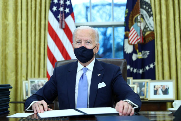 Biden rolls back Trump policies on Muslims, climate, health