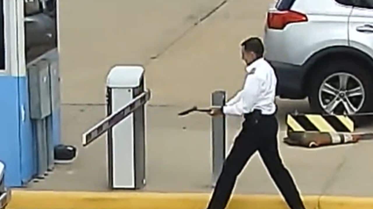 Pilot suspended after video shows him wielding axe, hitting parking lot gate