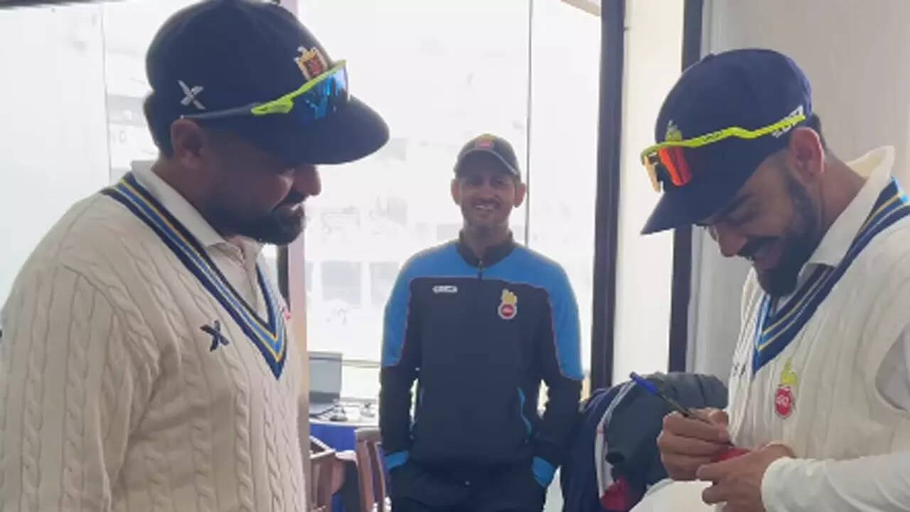 Himanshu Sangwan's fan moment, takes Virat Kohli's autograph after dismissing  him in Ranji Trophy | Cricket News - The Times of India